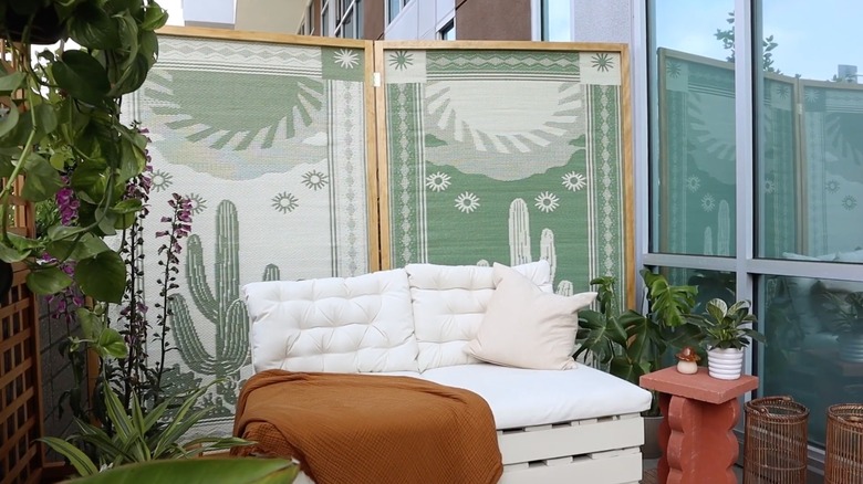 DIYers outdoor space, complete with a homemade privacy screen