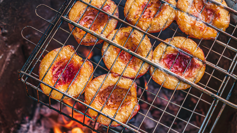 Grilled peaches over a fire