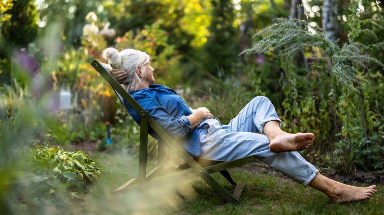Woman relaxing in her garden