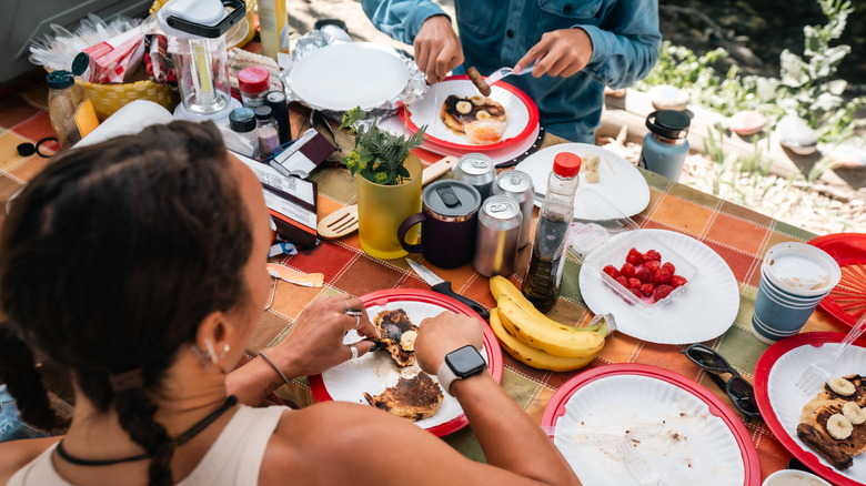 People enjoying breakfast on a camping trip