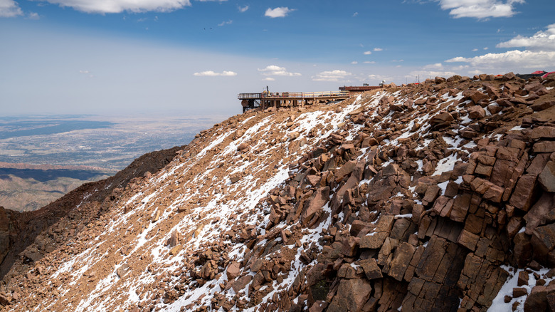 Pikes Peak summit with snowy slopes and blue sky
