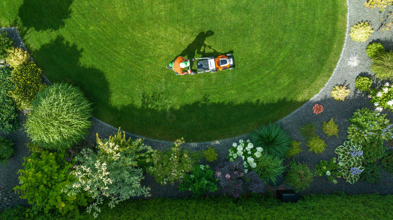 Aerial view of a man mowing a lawn