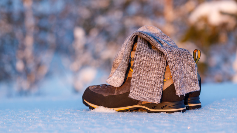 Socks and boots in snow