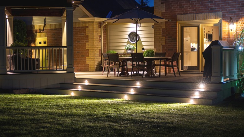 Garden deck with lights embedded in step risers