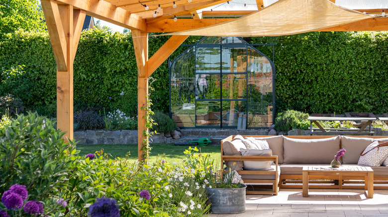 A luxurious outdoor space with seating and greenery