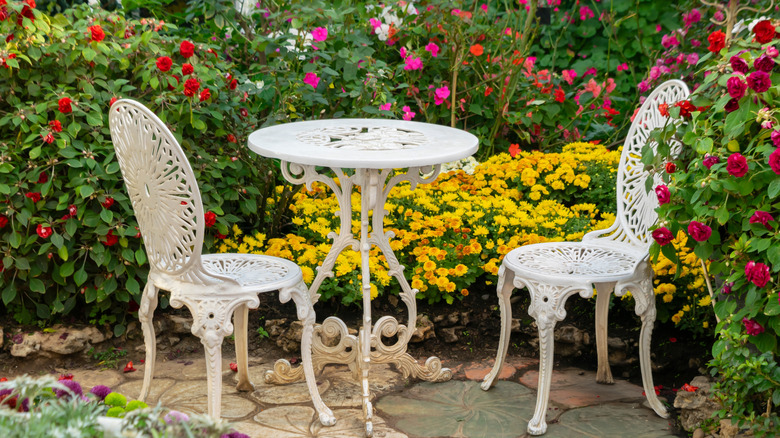 Patio table surrounded by flowers