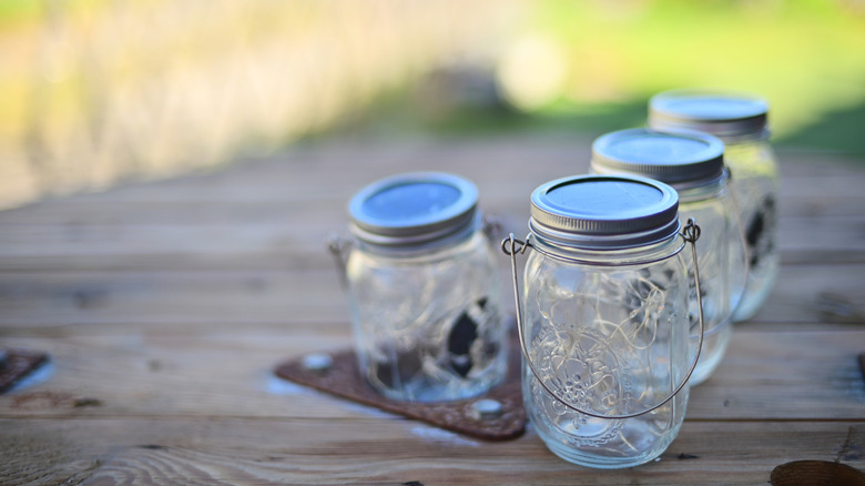 Glass mason jars on table