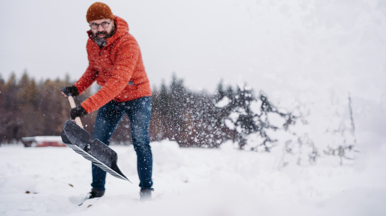 Man shovels snow