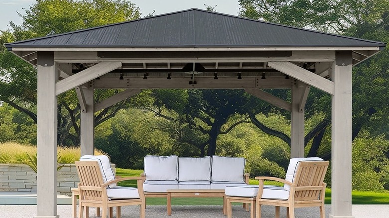 The 16'x16' timber-framed gazebo from Yardistry with outdoor furniture sheltered underneath