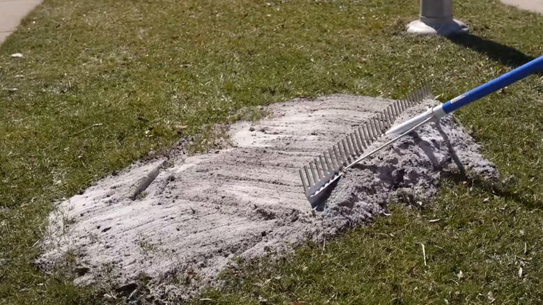 Leveling lawn using a landscape rake