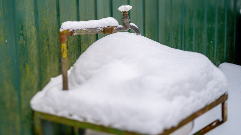 Outdoor pipes covered in snow