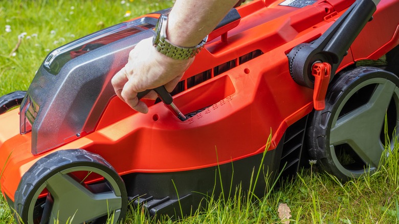 adjusting the height of lawn mower