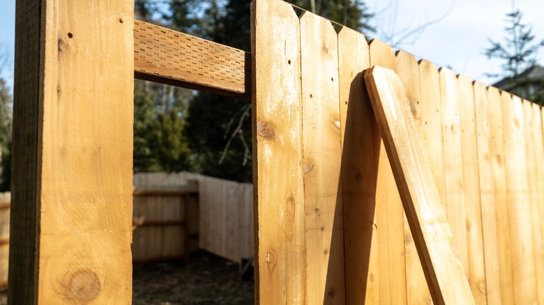 Cedar wood fence under construction