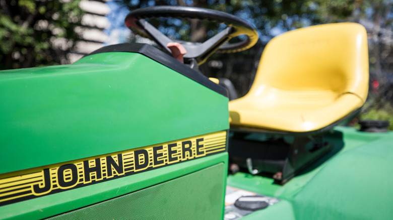 A close up of a John Deere lawn mower