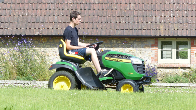 mowing with john deere riding mower in hot weather