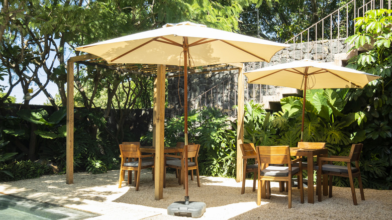 Patio with umbrellas, chairs, and tables