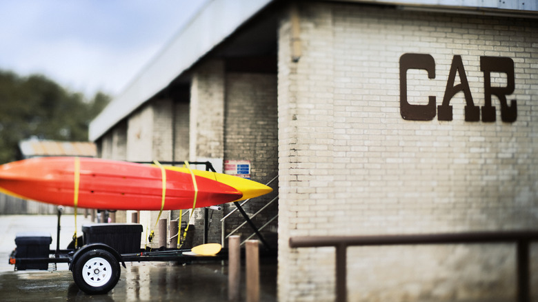Kayaks on trailer at car wash