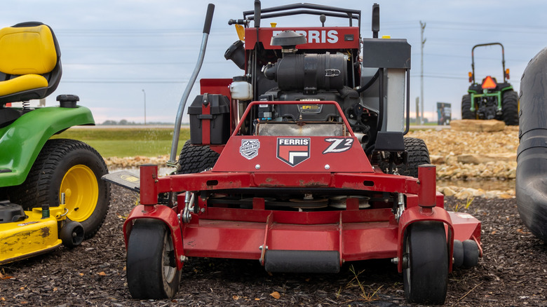 A red Ferris stand-on mower