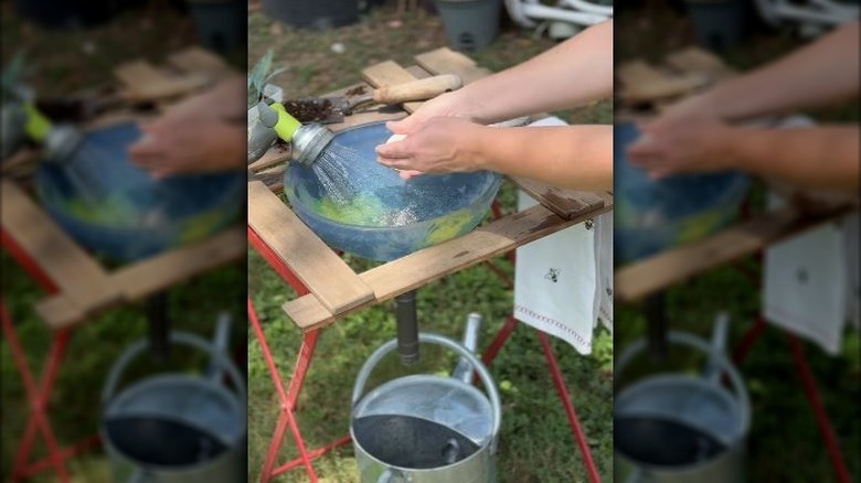 DIY garden sink using repurposed ceiling globe
