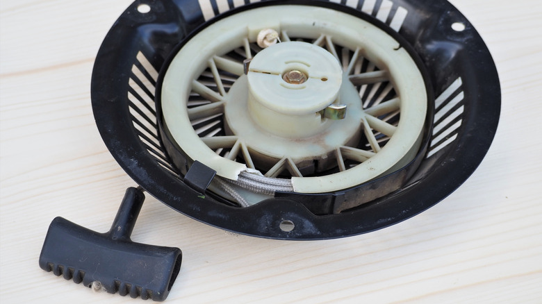 A lawn mower pull cord assembly