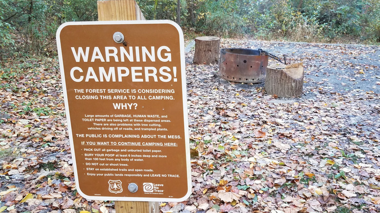 warning sign in dispersed camping area