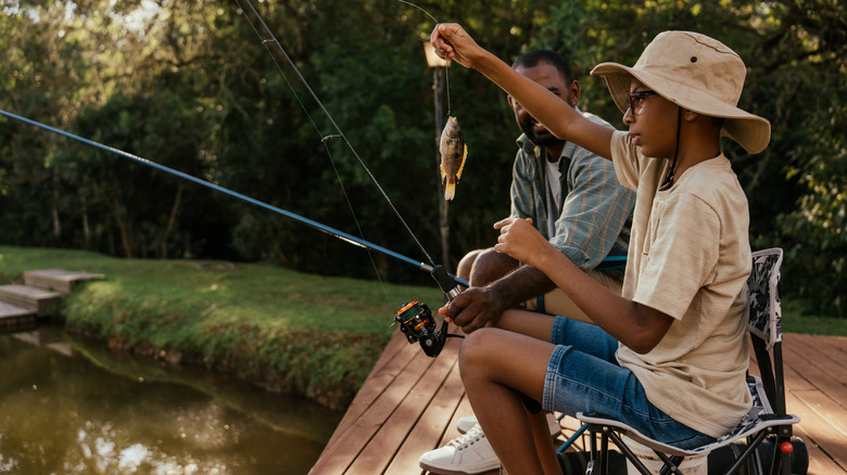 Young fisherman on dock