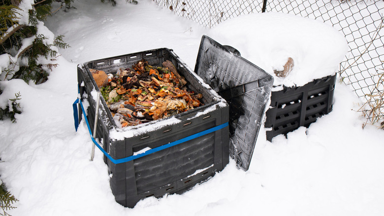Compost bins in a snow-covered yard