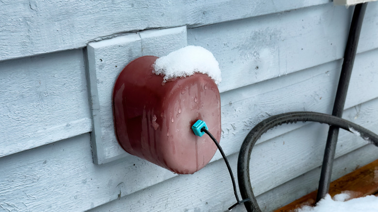 outdoor faucet covered with foam cover