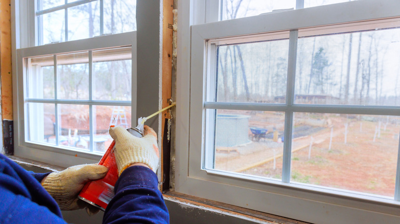 sealing gaps around windows with foam
