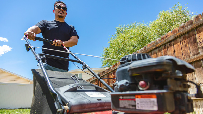 Person mowing lawn