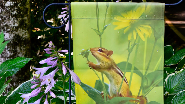 Garden flag depicting a chipmunk and flowers