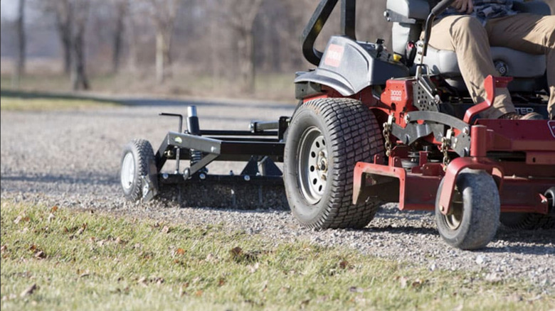 Grading a gravel driveway with a zero-turn mower