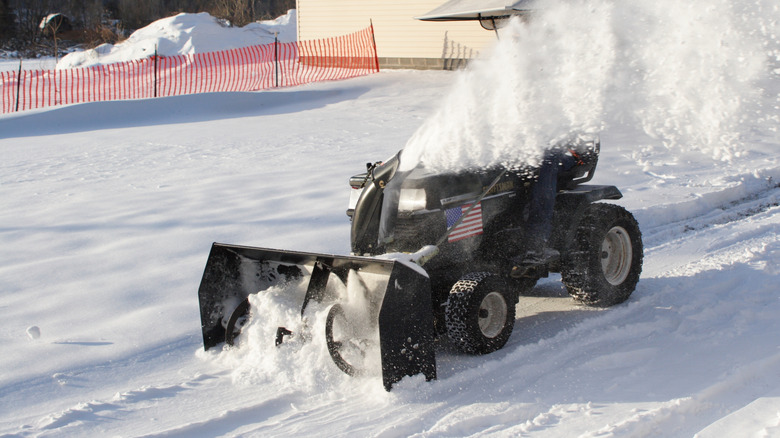 Mower with snow blower in action