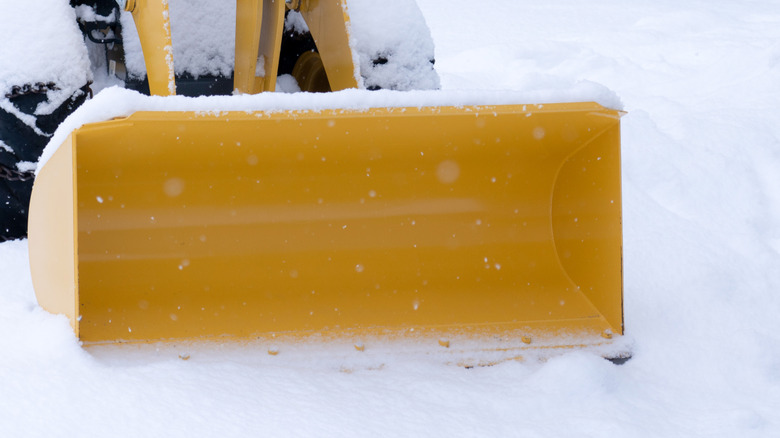 Snow plow on rider mower