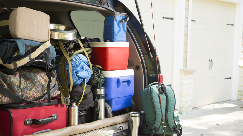 camping gear packed into a car