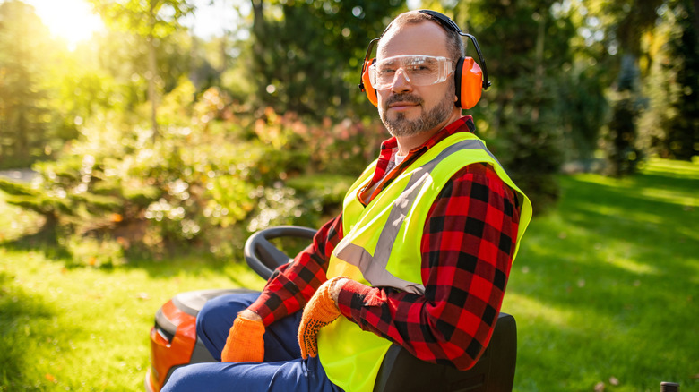 Landscaper on a riding lawn mower