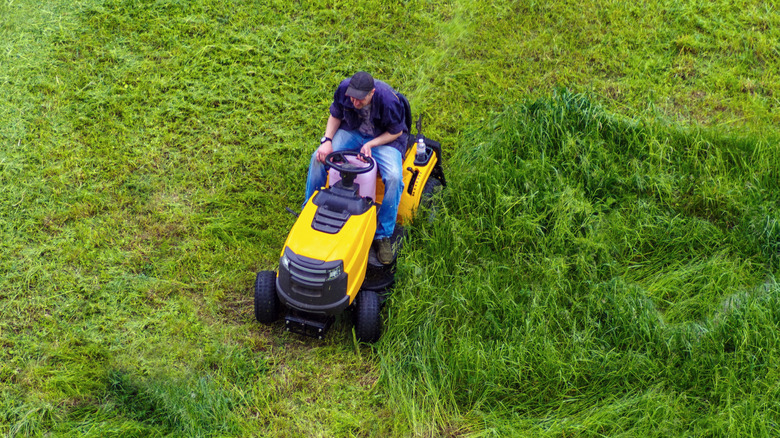 Man on a riding lawn mower
