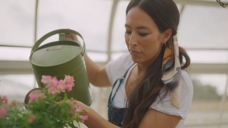 Joanna Gaines with a potted plant