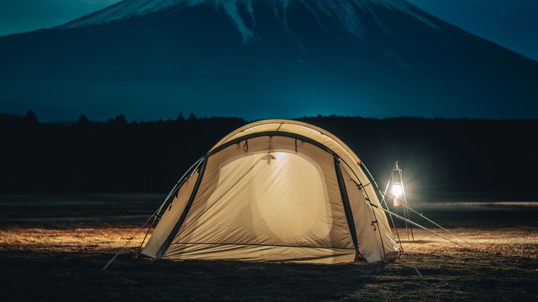 tent with lantern in front