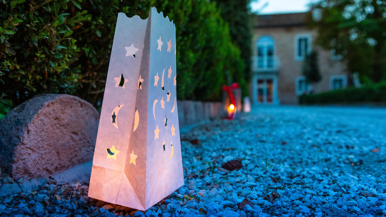 White paper bag lantern with stars and moons
