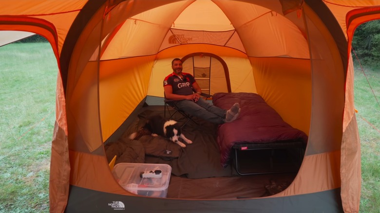 Man and dog comfortably set up in Wawona 6 sleeping quarters