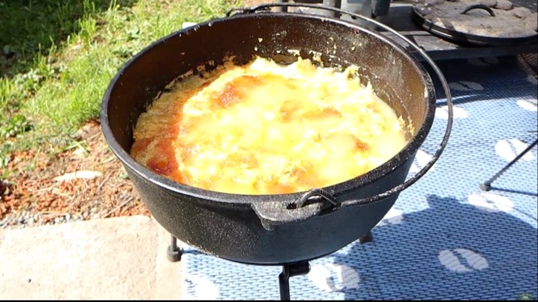 A Dutch oven filled with apple cobbler