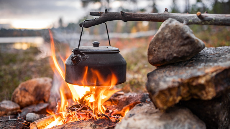 A one-dish meal hanging over a campfire