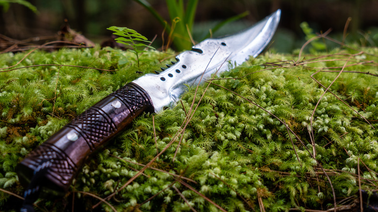 Bushcraft survival knife with an ornate handle