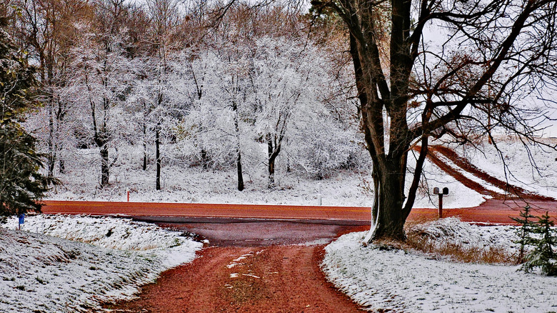 Red gravel driveway in winter