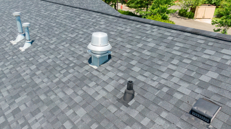 Various vents protruding from roof of house