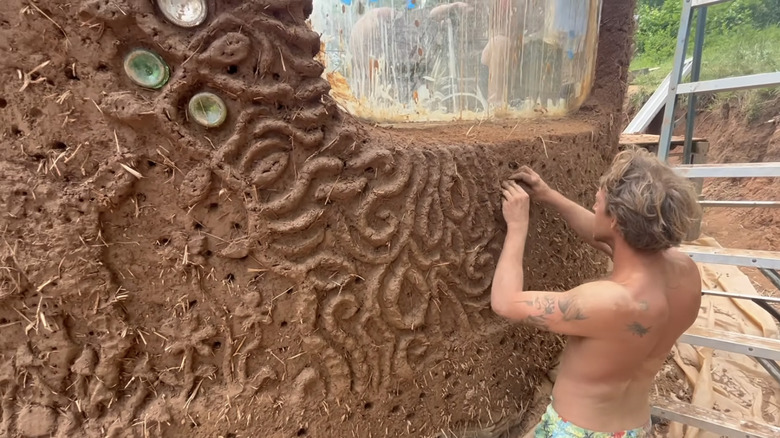 A customized cob wall with built-in glass jars