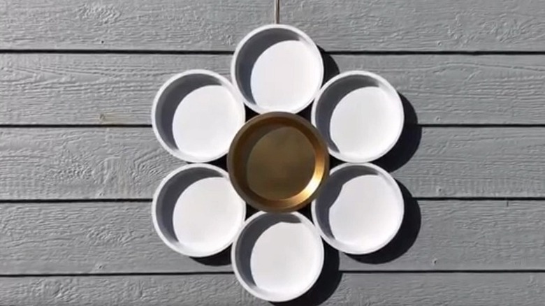 Wall art made from repurposed pie tins