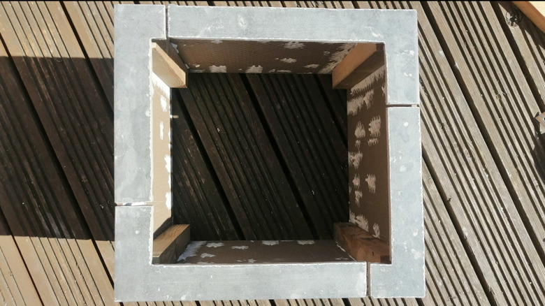 A screenshot of DIY Dan's video where he builds a rim for the planter