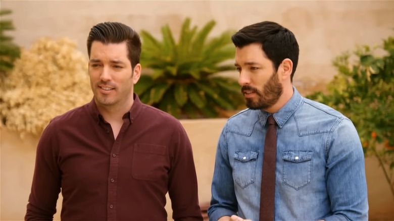 Jonathan and Drew Scott speaking outside
